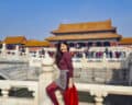 Tourist girl posing at ancient Imperial city of China in Beijing