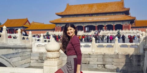 Tourist girl posing at ancient Imperial city of China in Beijing