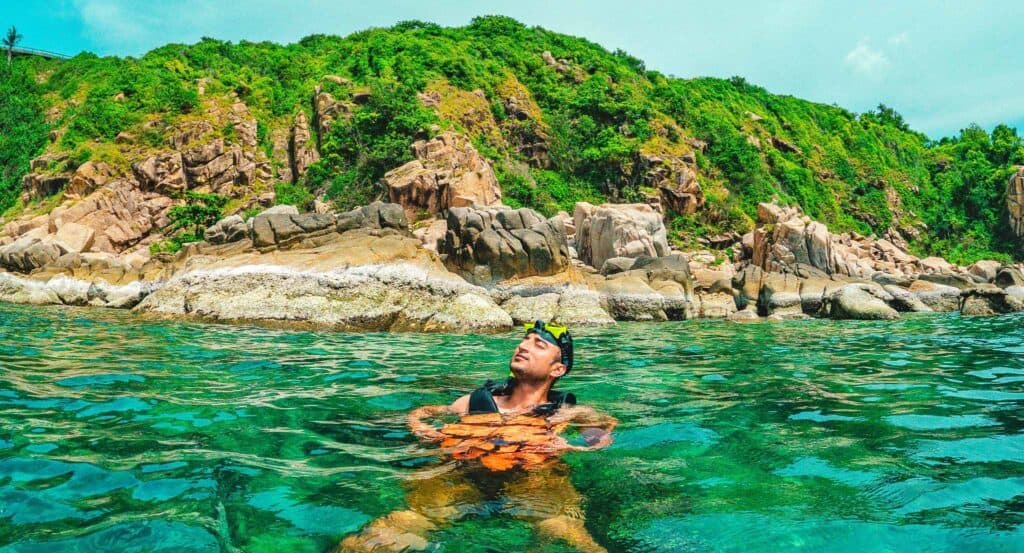 Pakistani tourist enjoying snorkeling in Manta bay near Nusa Penida island