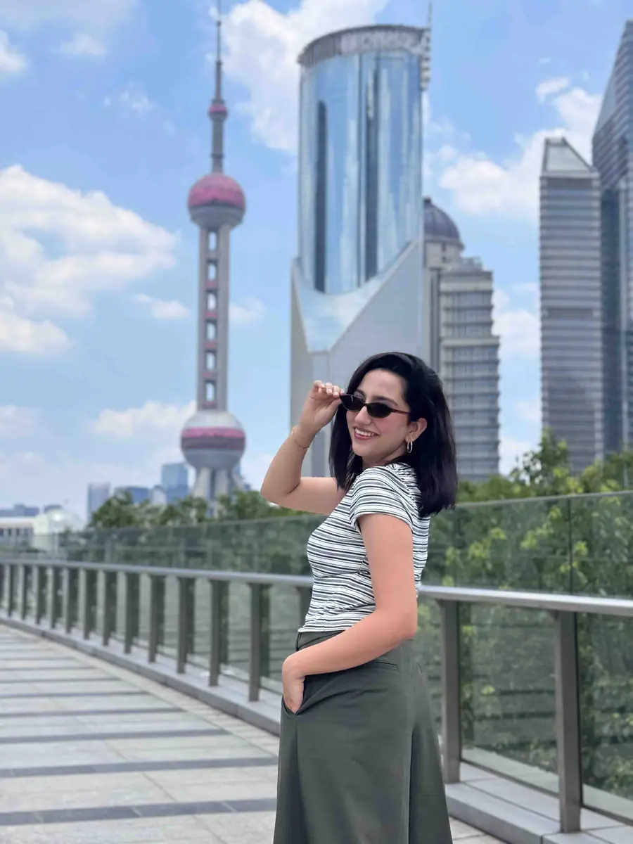 Tales of Time traveller on the Bund with the Oriental Pearl Tower behind