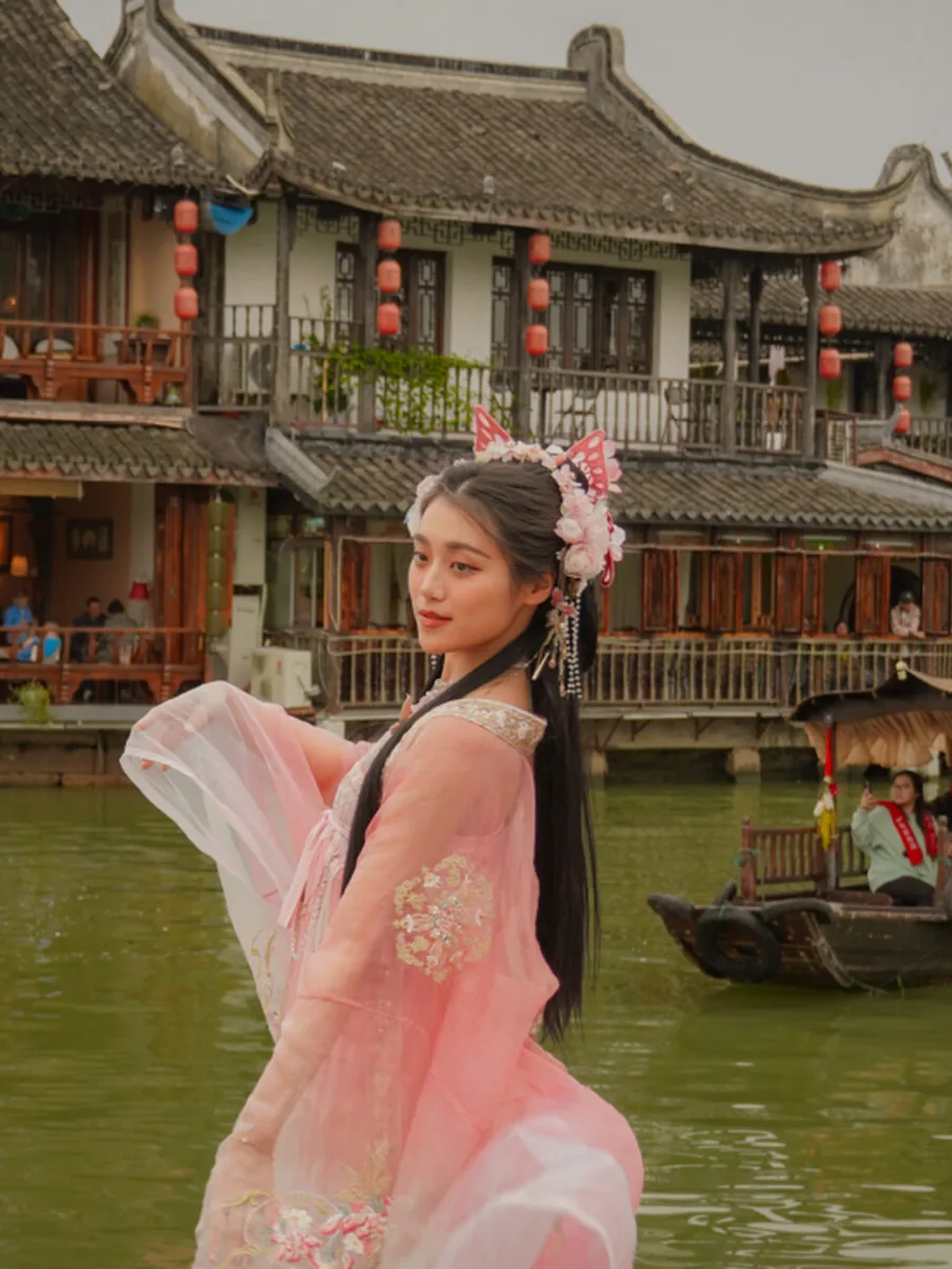 Traveller in hanfu dress by the canal at Zhujiajiao water town, Shanghai